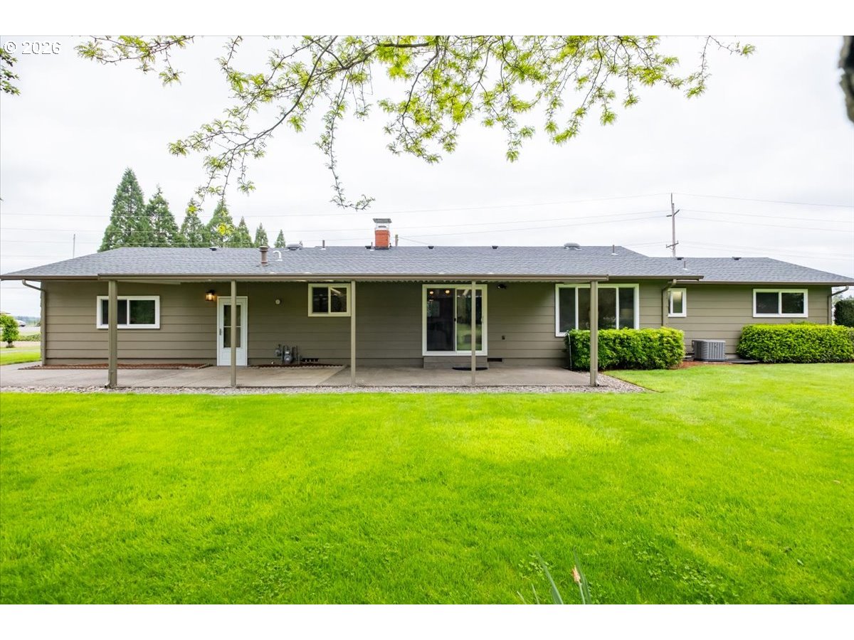 2610 Shaff Road Southeast Aumsville, OR 97325 - Photo 24 of 25 a front view of a house with a garden