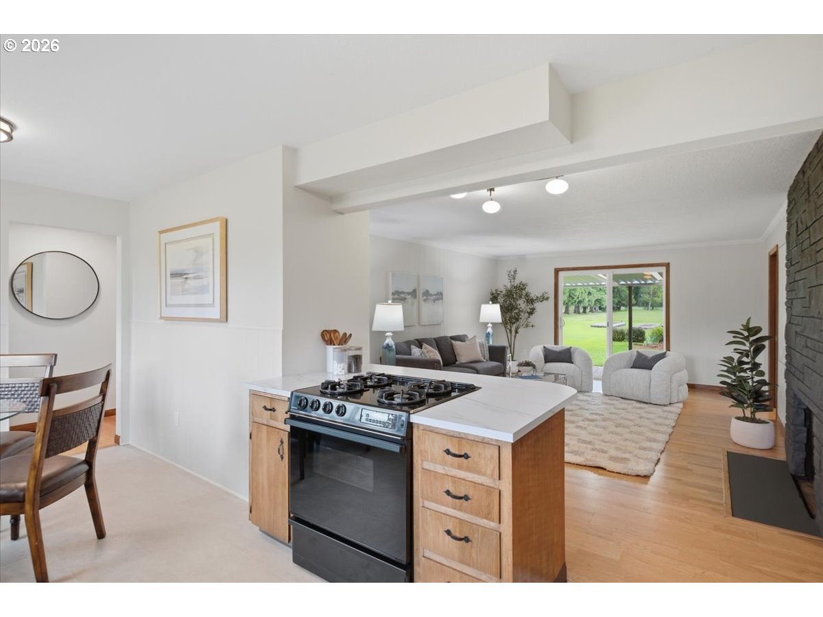 2610 Shaff Road Southeast Aumsville, OR 97325 - Photo 9 of 25 a kitchen that has a stove and a table in it