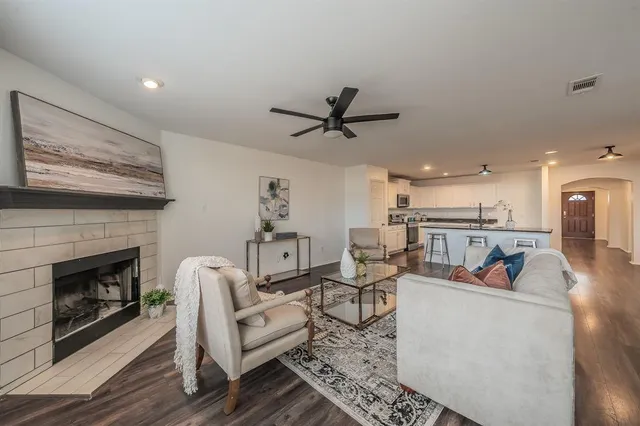 a living room with furniture and a fireplace