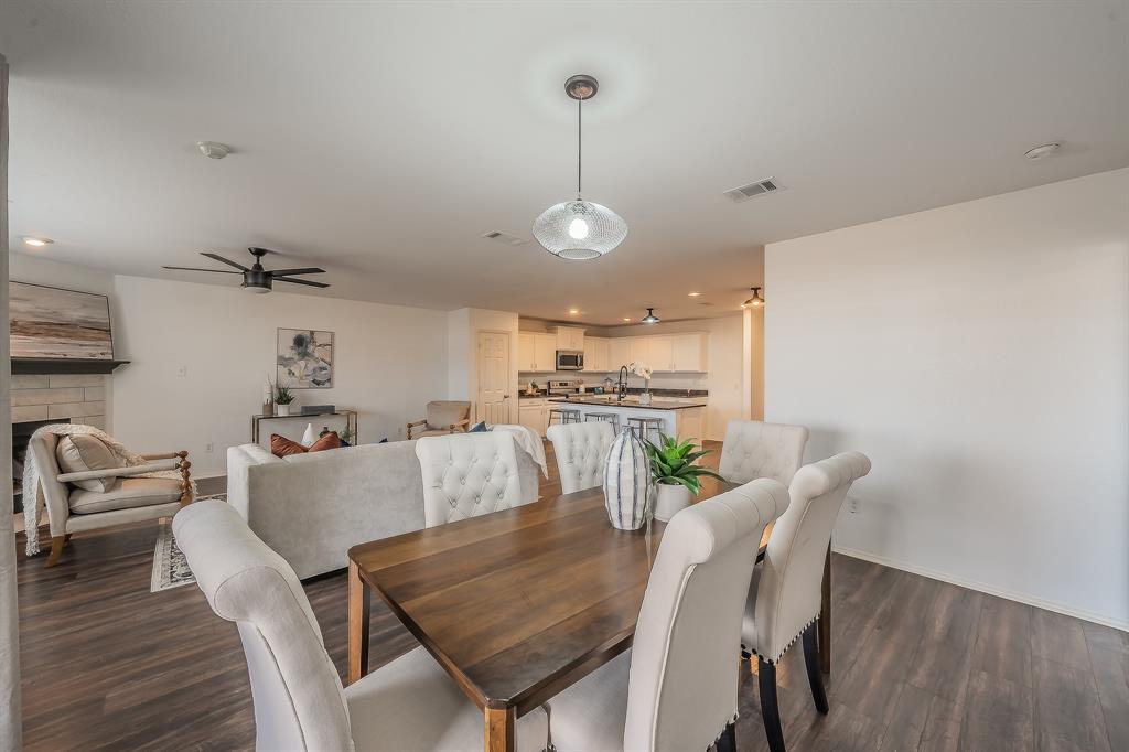 10541 Rising Knoll Lane Fort Worth, TX 76131 - Photo 12 of 27 a view of a dining room with furniture wooden floor and chandelier