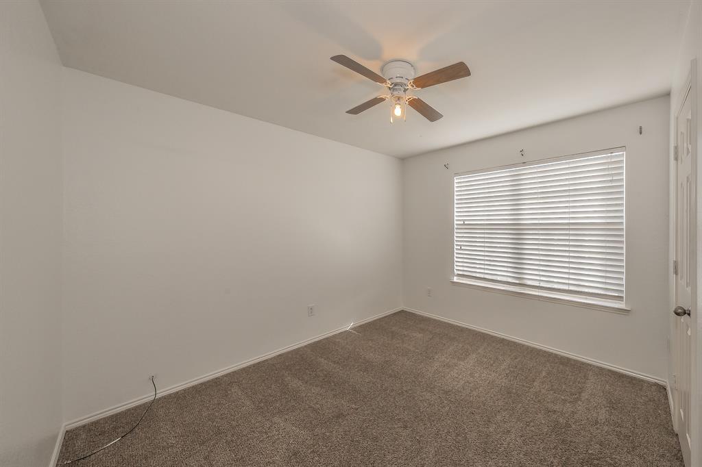 10541 Rising Knoll Lane Fort Worth, TX 76131 - Photo 14 of 27 a view of a livingroom with a ceiling fan and window