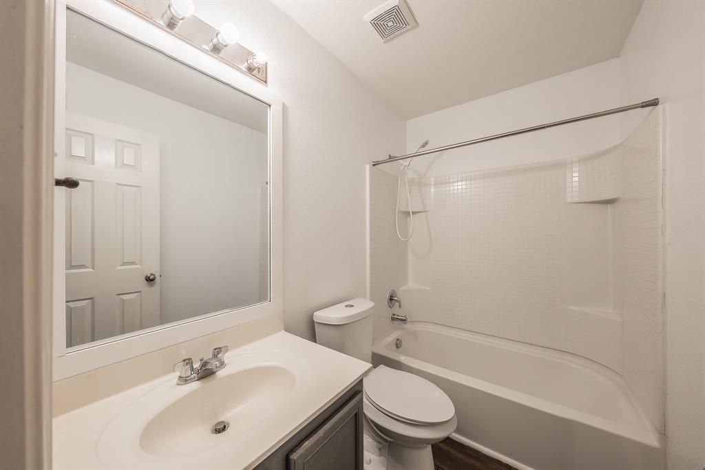 10541 Rising Knoll Lane Fort Worth, TX 76131 - Photo 17 of 27 a bathroom with a sink toilet and shower