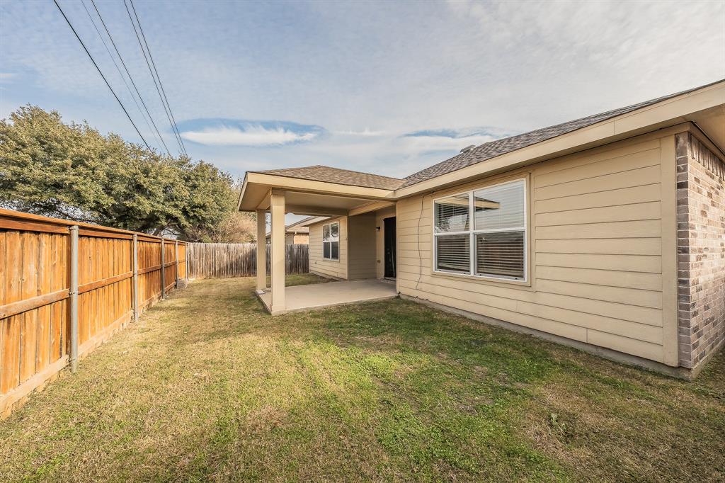 10541 Rising Knoll Lane Fort Worth, TX 76131 - Photo 24 of 27 a view of a house with a backyard