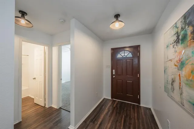 a view of entryway with wooden floor