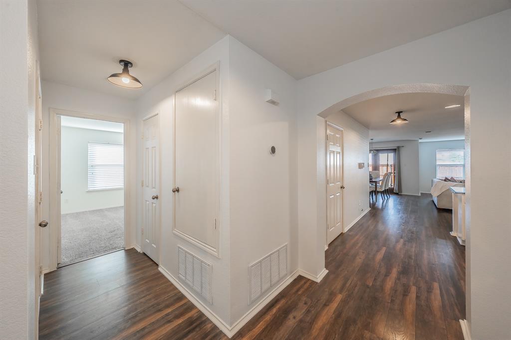 10541 Rising Knoll Lane Fort Worth, TX 76131 - Photo 6 of 27 a view of a hallway with wooden floor and closet