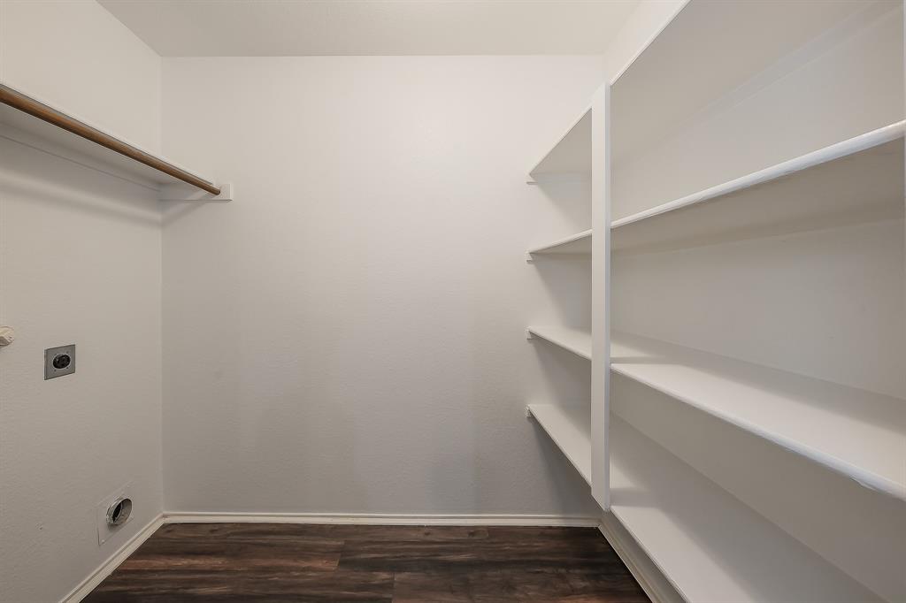 10541 Rising Knoll Lane Fort Worth, TX 76131 - Photo 7 of 27 a view of walk in closet with empty racks