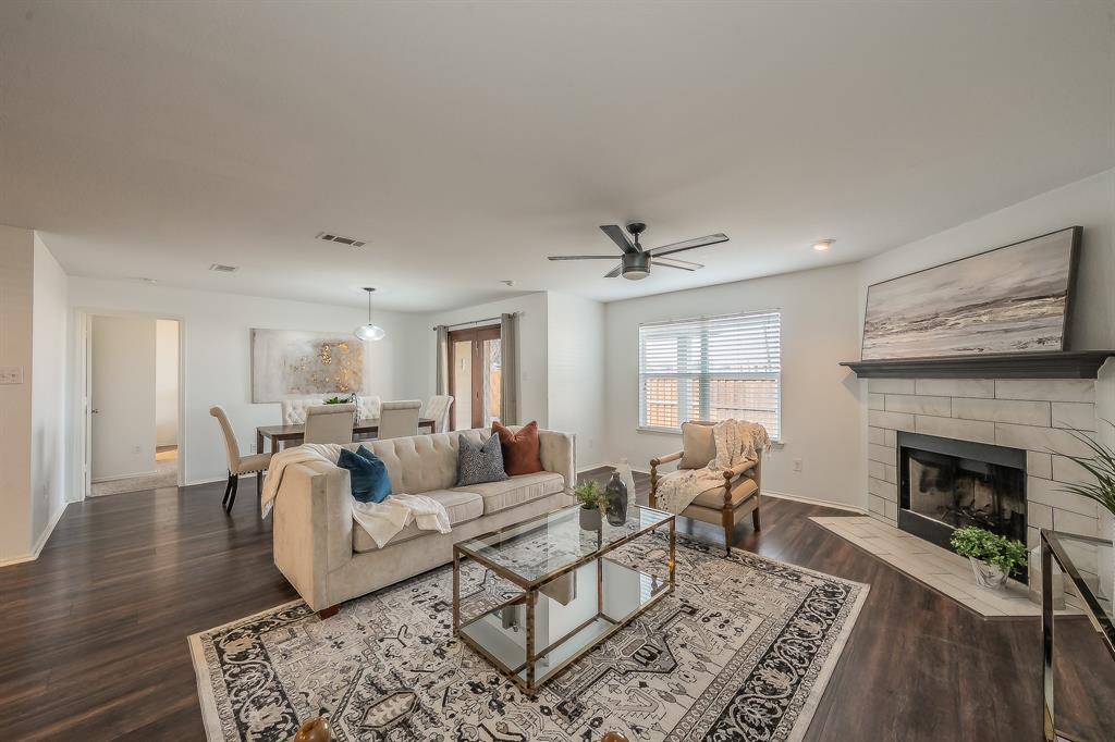 10541 Rising Knoll Lane Fort Worth, TX 76131 - Photo 8 of 27 a living room with furniture and a fireplace