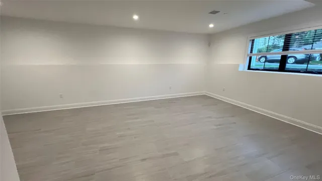 an empty room with a empty space and window