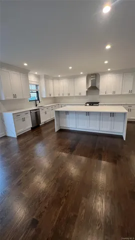 a kitchen with stainless steel appliances a refrigerator sink and cabinets