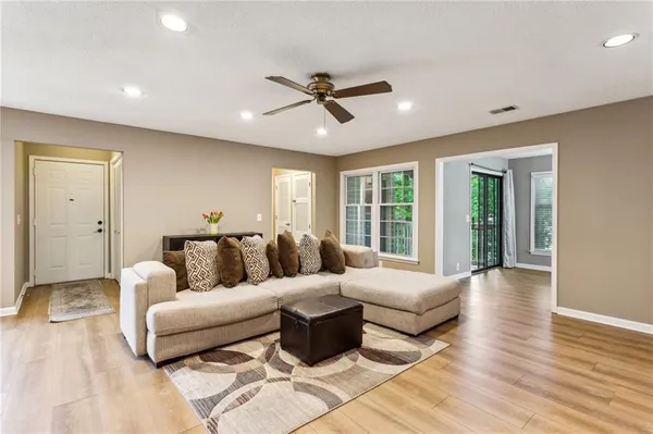 a living room with furniture and a large window