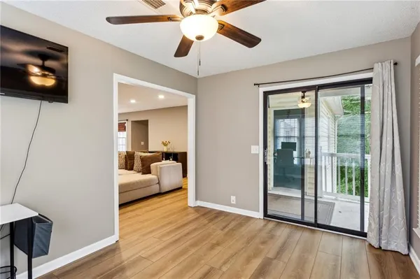 a view of a livingroom with furniture and flat screen tv
