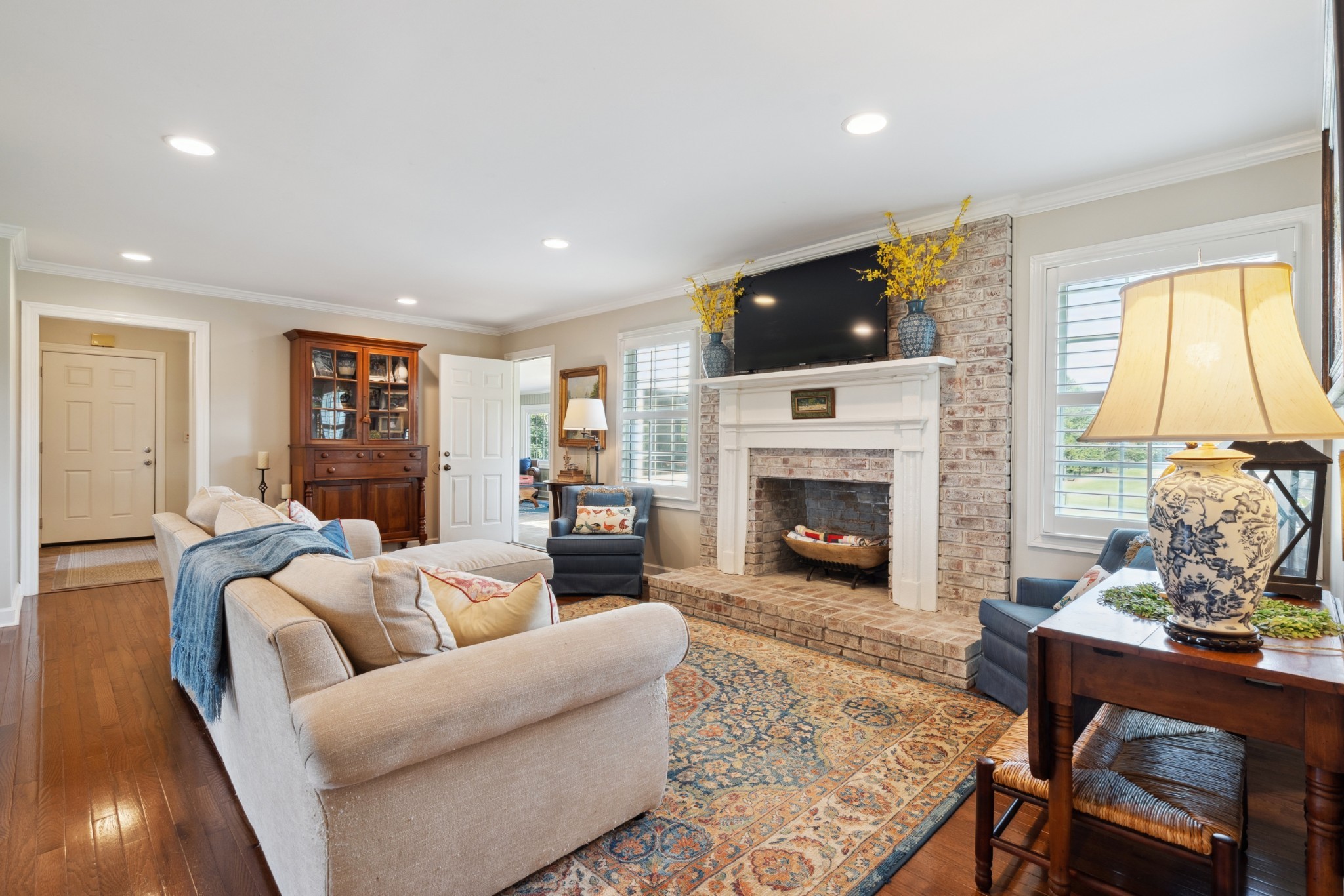 5013 Baker Road Murfreesboro, TN 37129 - Photo 20 of 55 a living room with furniture a fireplace and a flat screen tv