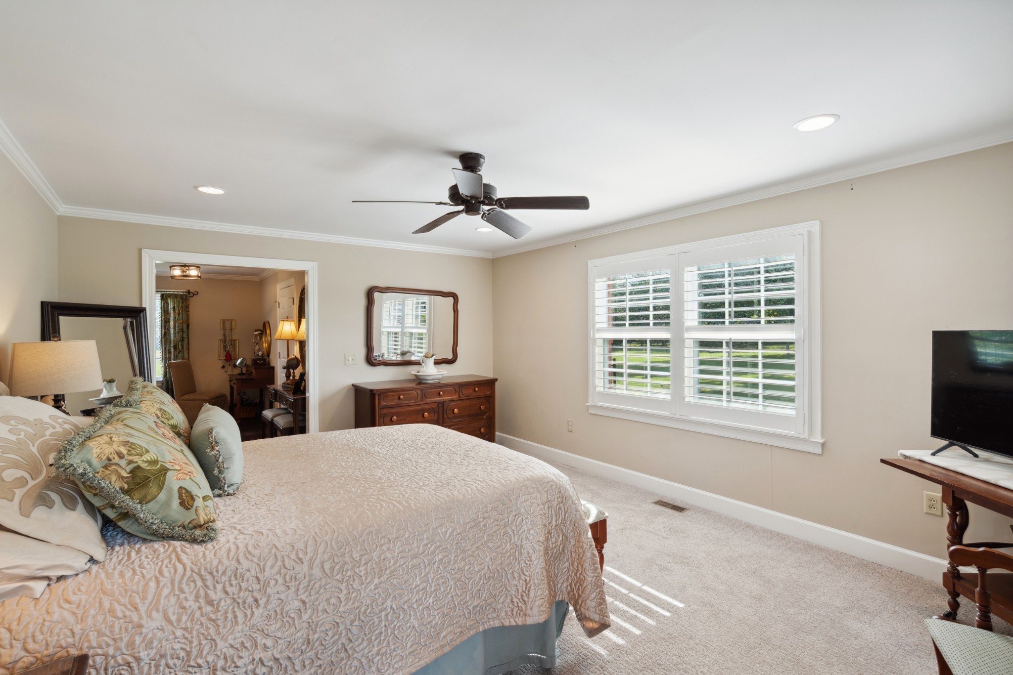 5013 Baker Road Murfreesboro, TN 37129 - Photo 26 of 55 a bedroom with a bed a chandelier and a flat screen tv