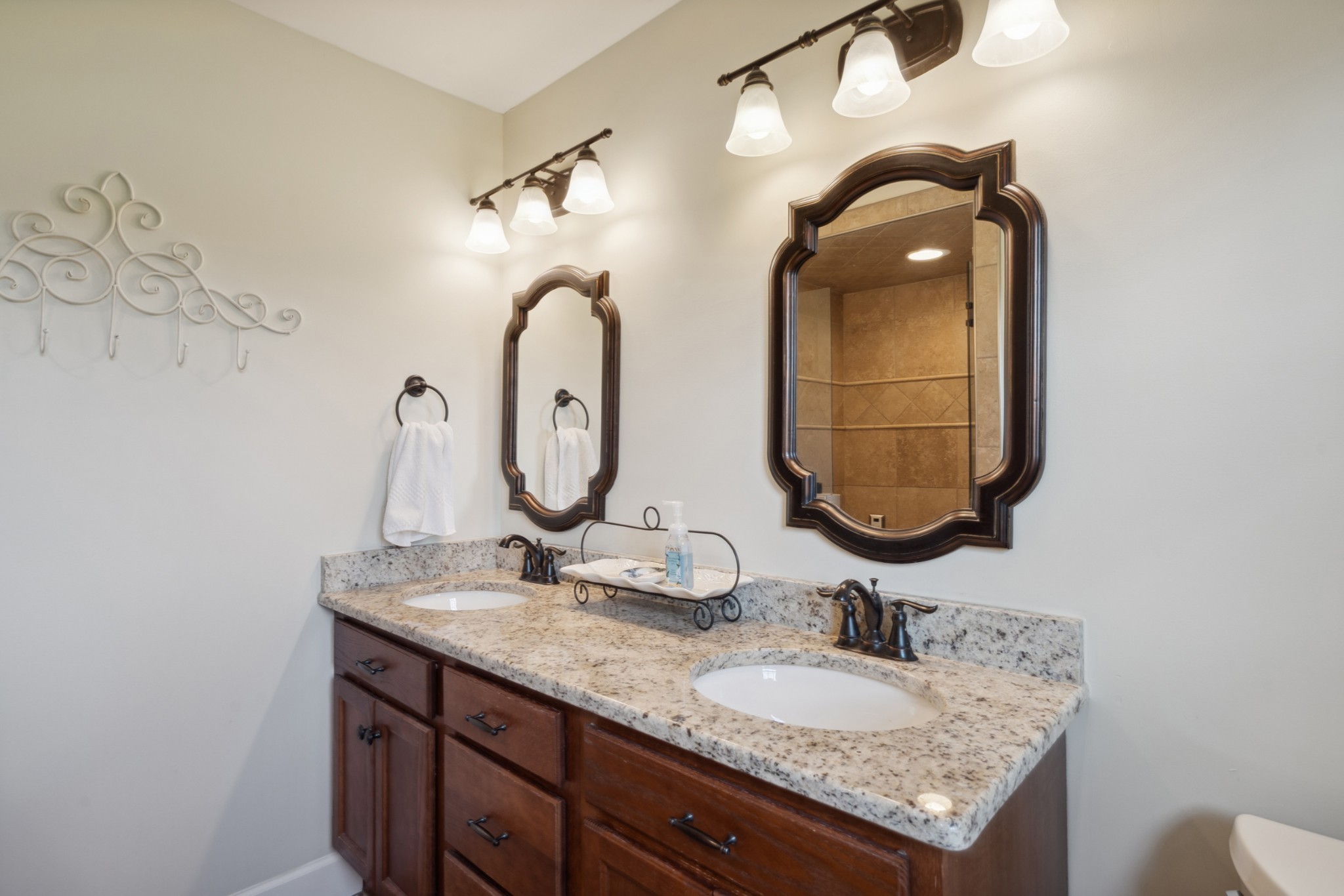5013 Baker Road Murfreesboro, TN 37129 - Photo 30 of 55 a bathroom with a granite countertop sink and a mirror