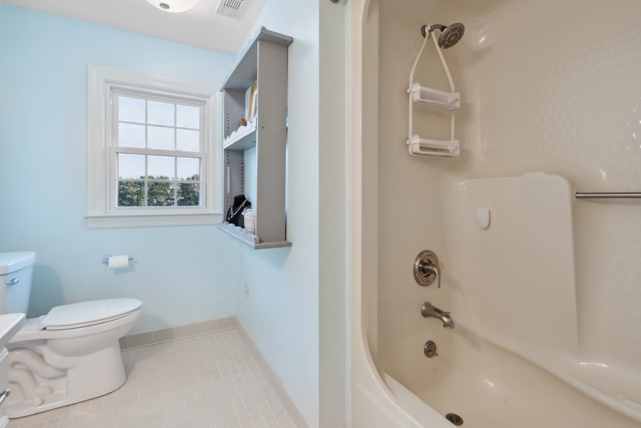 5013 Baker Road Murfreesboro, TN 37129 - Photo 34 of 55 a bathroom with a bathtub toilet and window