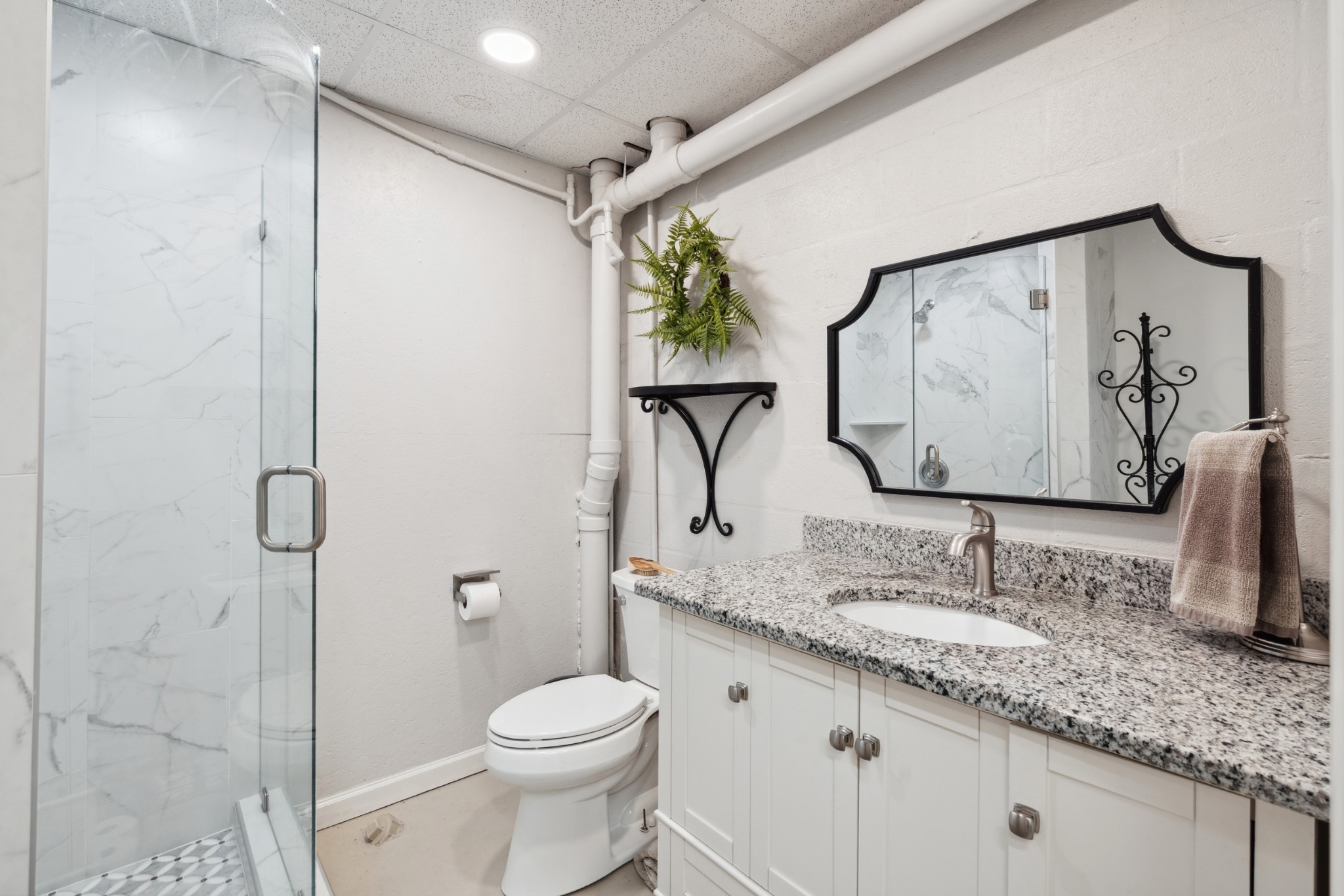 5013 Baker Road Murfreesboro, TN 37129 - Photo 41 of 55 a bathroom with a granite countertop sink toilet and shower