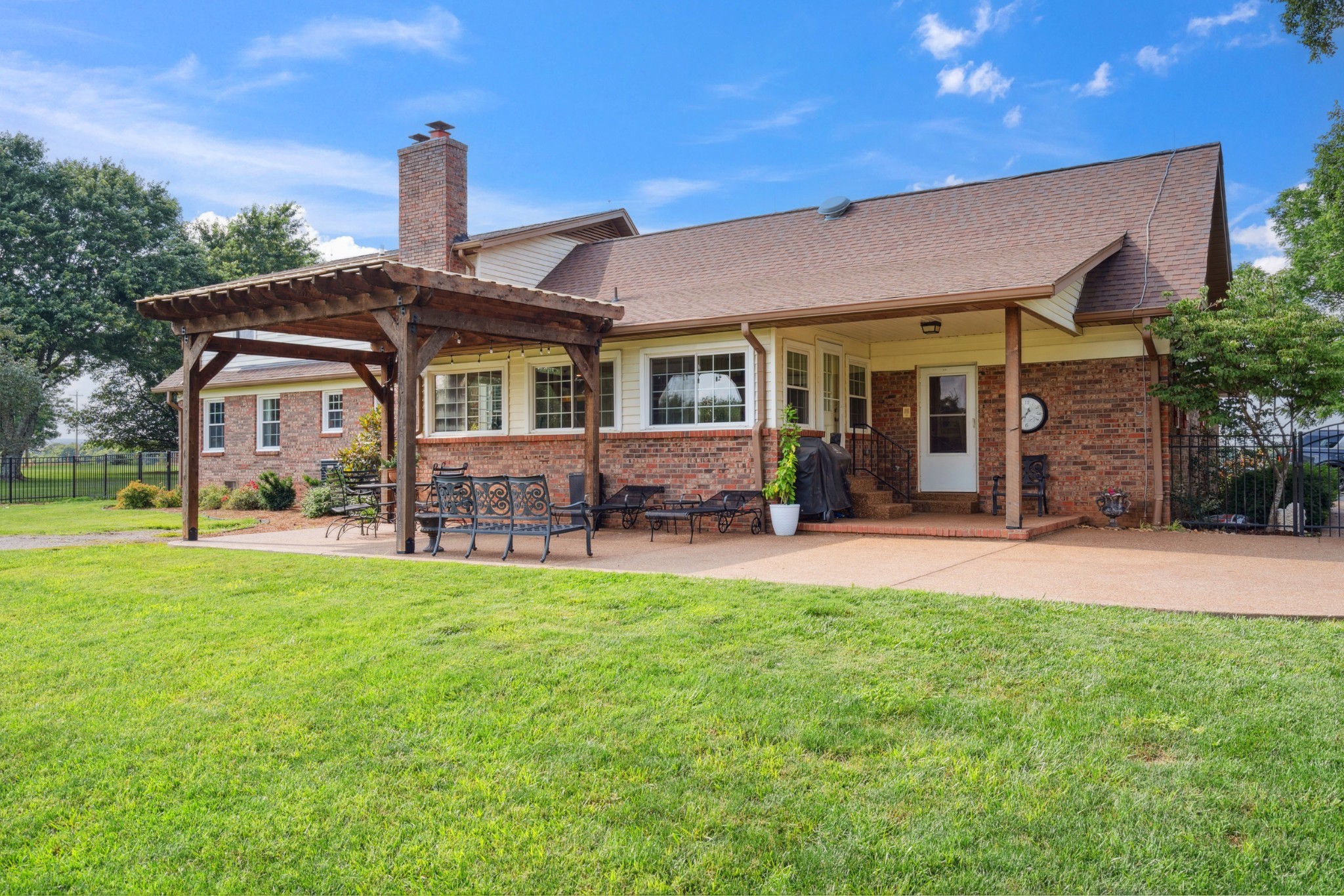 5013 Baker Road Murfreesboro, TN 37129 - Photo 50 of 55 a front view of a house with a garden and yard