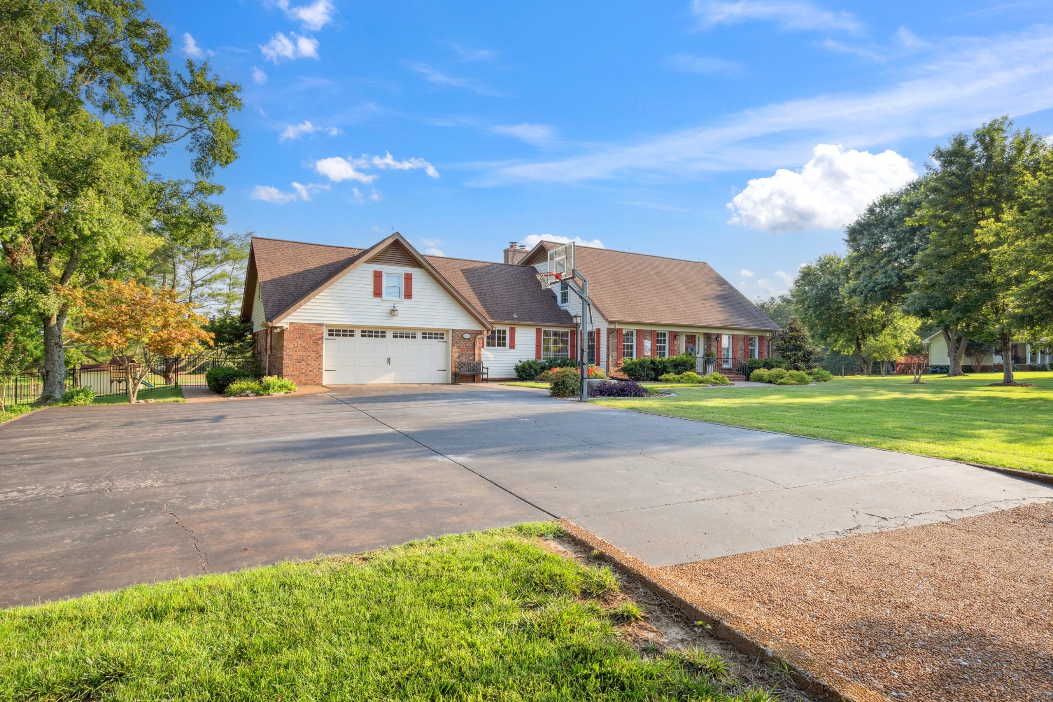 5013 Baker Road Murfreesboro, TN 37129 - Photo 6 of 55 a view of big house with garden and tall trees