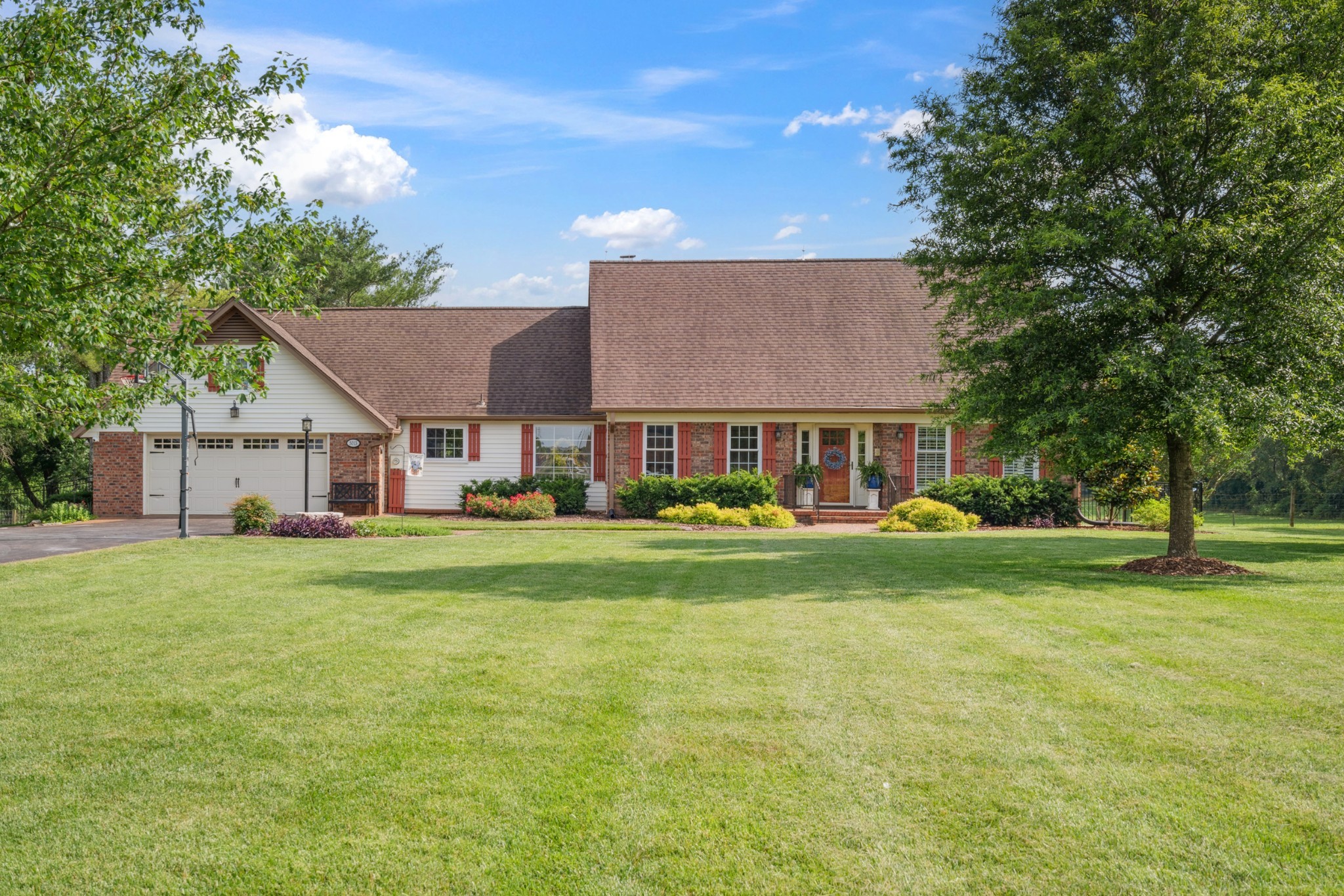 5013 Baker Road Murfreesboro, TN 37129 - Photo 7 of 55 a front view of a house with garden and porch
