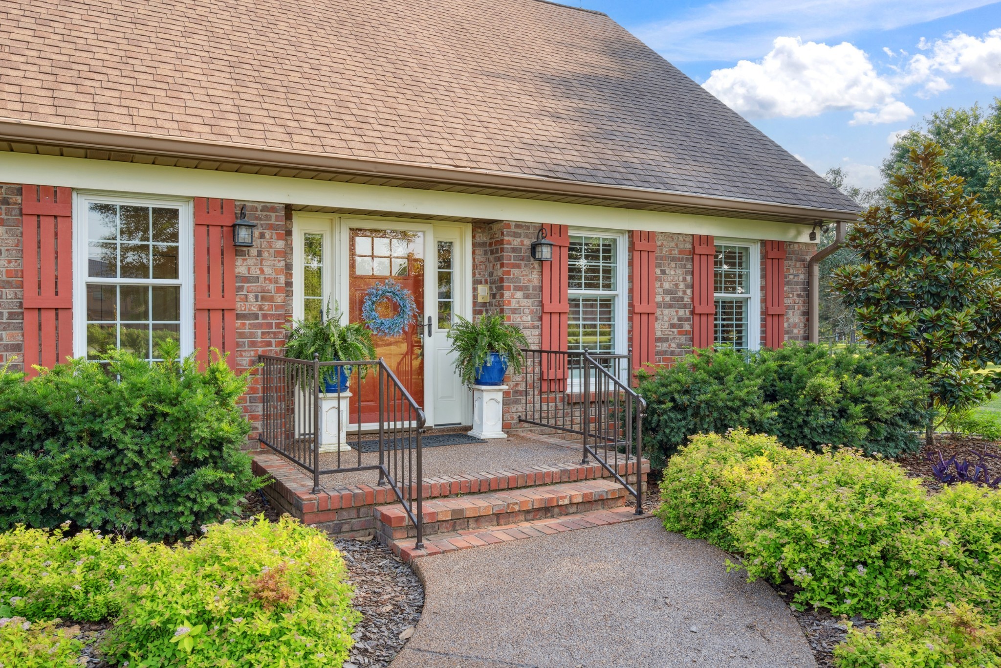 5013 Baker Road Murfreesboro, TN 37129 - Photo 8 of 55 a front view of a house with garden