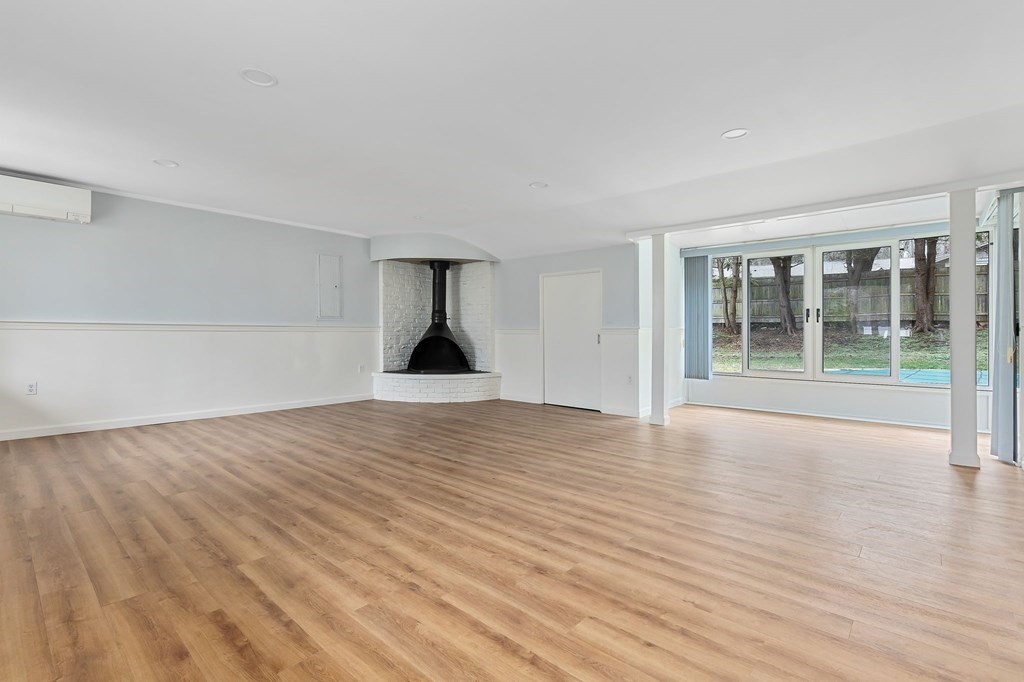 42 Amherst Road Beverly, MA 01915 - Photo 12 of 23 a view of empty room with wooden floor and window