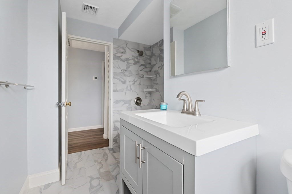 42 Amherst Road Beverly, MA 01915 - Photo 13 of 23 a bathroom with a sink a toilet and shower