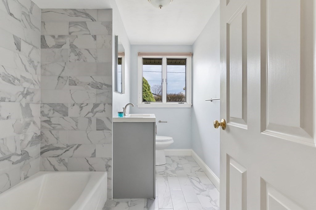 42 Amherst Road Beverly, MA 01915 - Photo 14 of 23 a bathroom with a bathtub and a sink