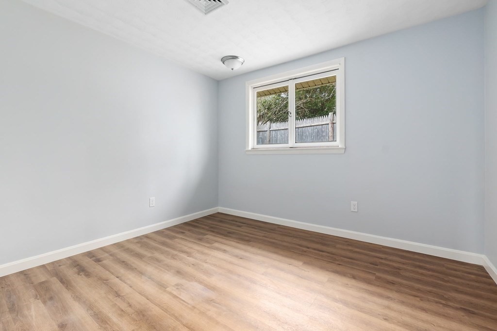 42 Amherst Road Beverly, MA 01915 - Photo 19 of 23 an empty room with a window
