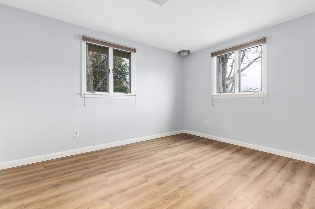 42 Amherst Road Beverly, MA 01915 - Photo 21 of 23 a view of an empty room with wooden floor and a window