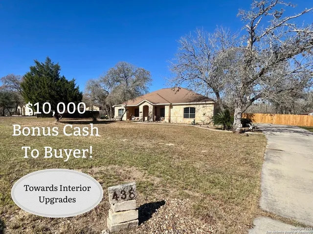 a view of a park that has a sign board