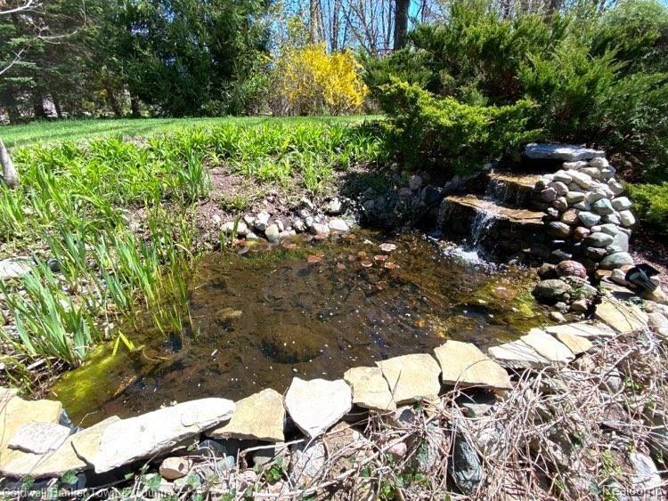 4233 Augusta Court Howell, MI 48843 - Photo 40 of 49 Backyard Koi Pond!