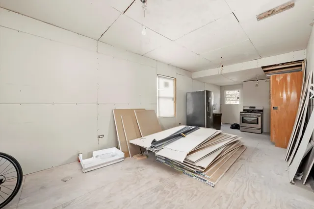 a bed room with a bed and dresser