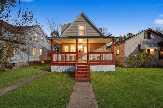 a front view of a house with a yard