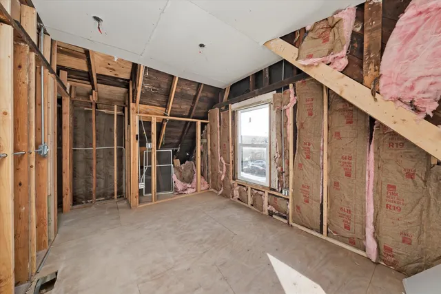 a view of an empty room with windows