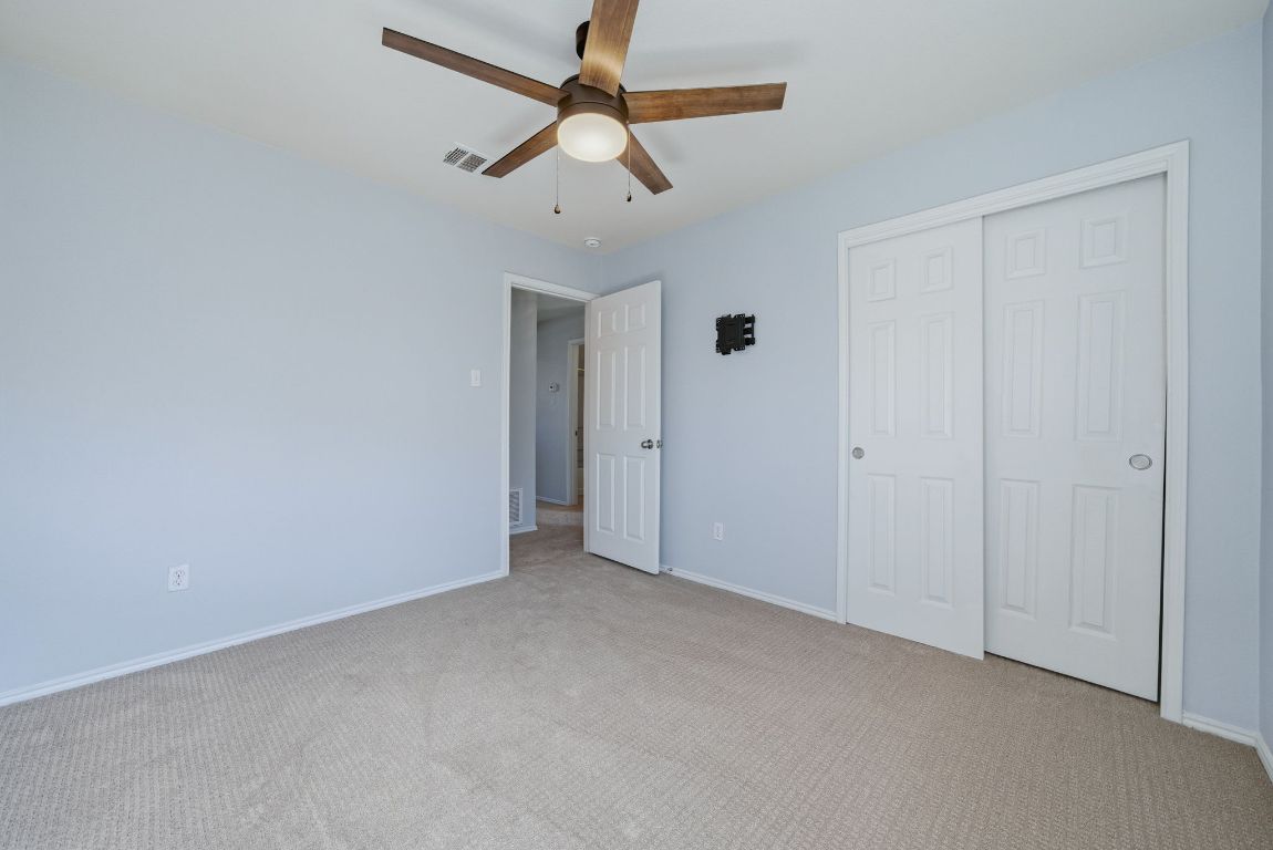 18153 Basket Flower Bend Elgin, TX 78621 - Photo 14 of 35 a view of a room with a ceiling fan