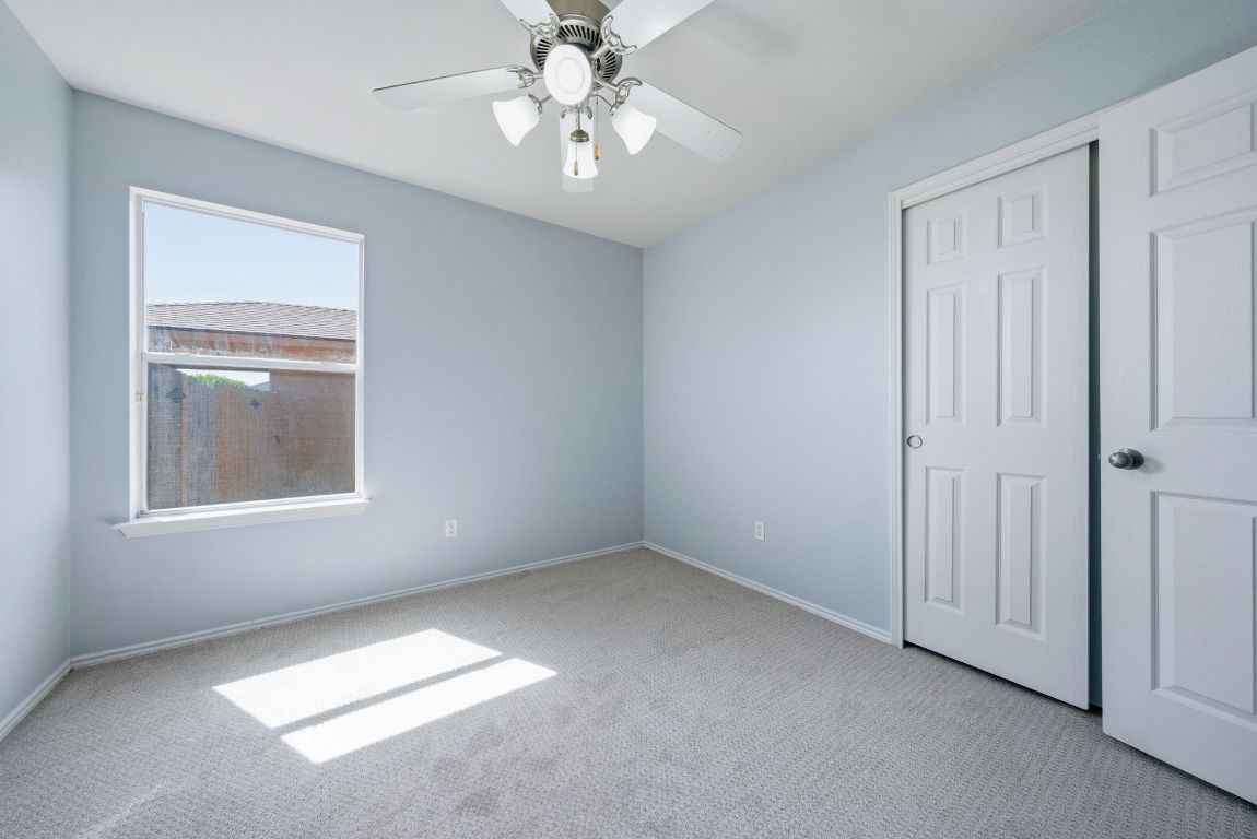 18153 Basket Flower Bend Elgin, TX 78621 - Photo 18 of 35 an empty room with chandelier fan