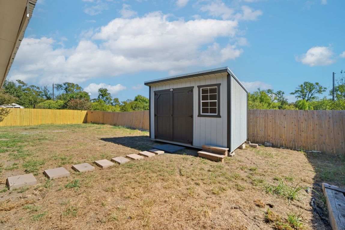 18153 Basket Flower Bend Elgin, TX 78621 - Photo 31 of 35 a view of backyard with wooden fence
