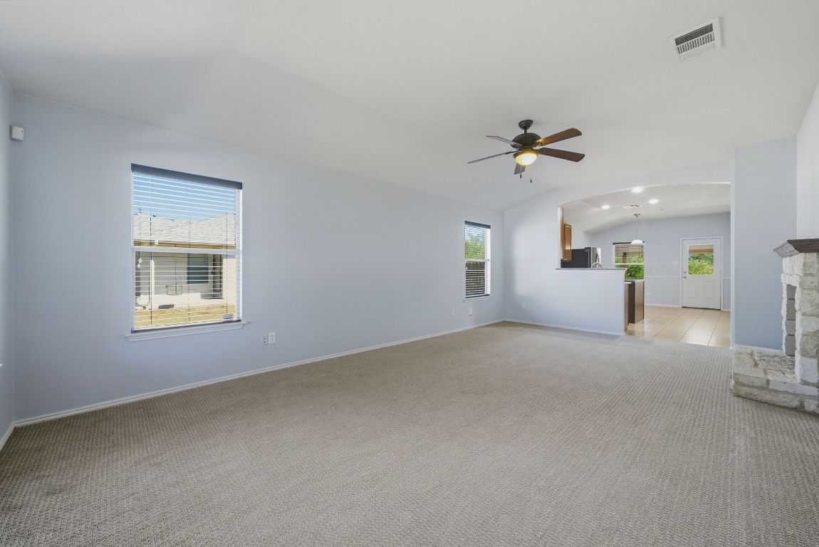 18153 Basket Flower Bend Elgin, TX 78621 - Photo 4 of 35 a view of a livingroom with a ceiling fan and window