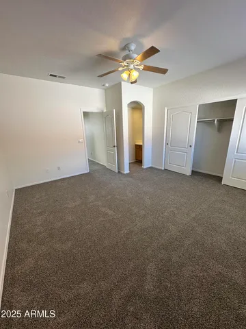 a view of a big room with windows