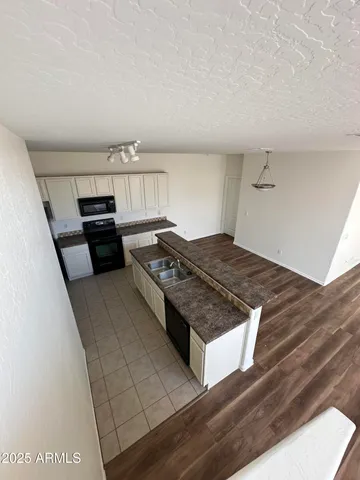 a kitchen with a stove and a refrigerator