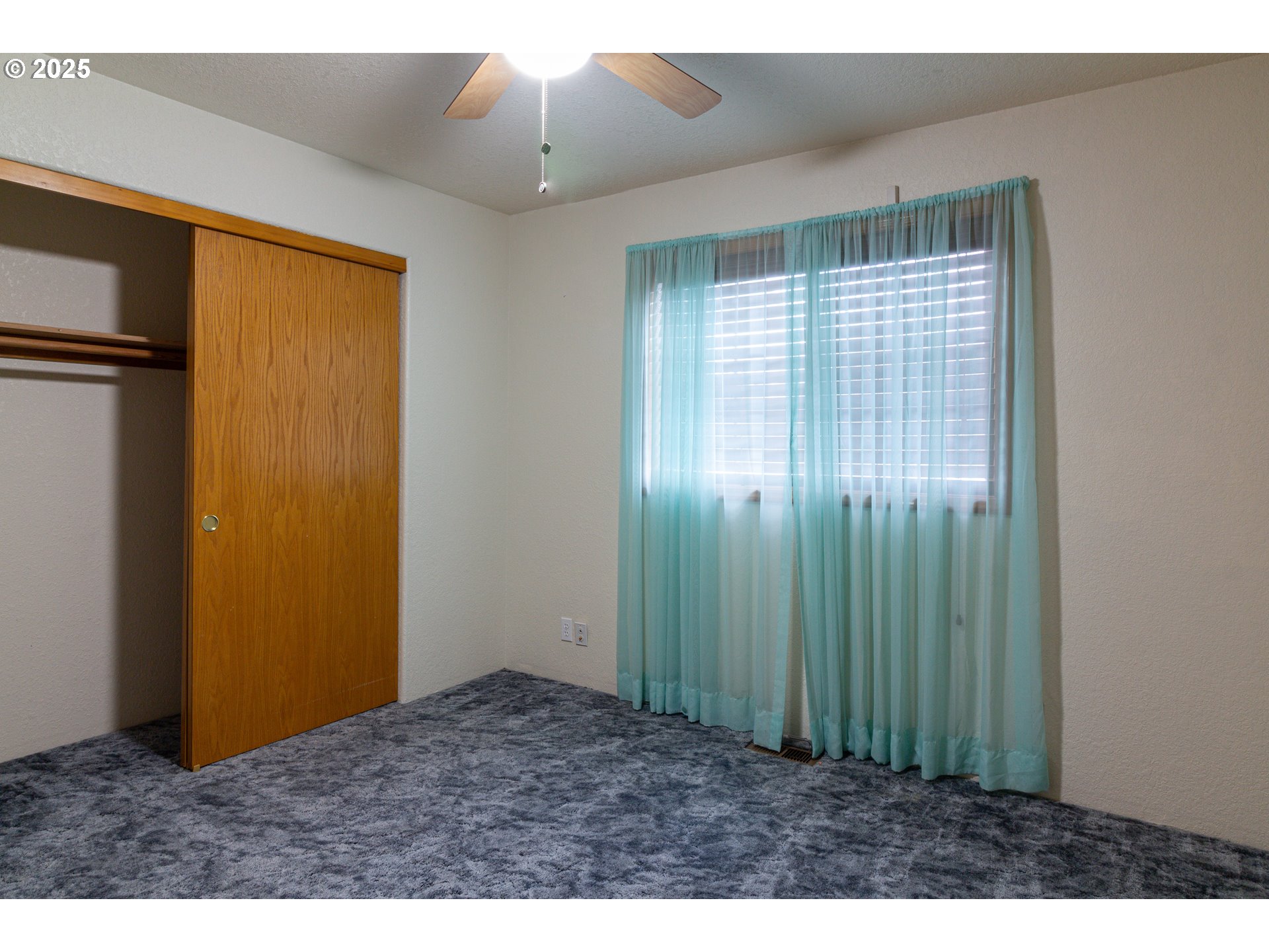 305 Northwest 9th Place Hermiston, OR 97838 - Photo 11 of 31 a view of an empty room with window and stairs