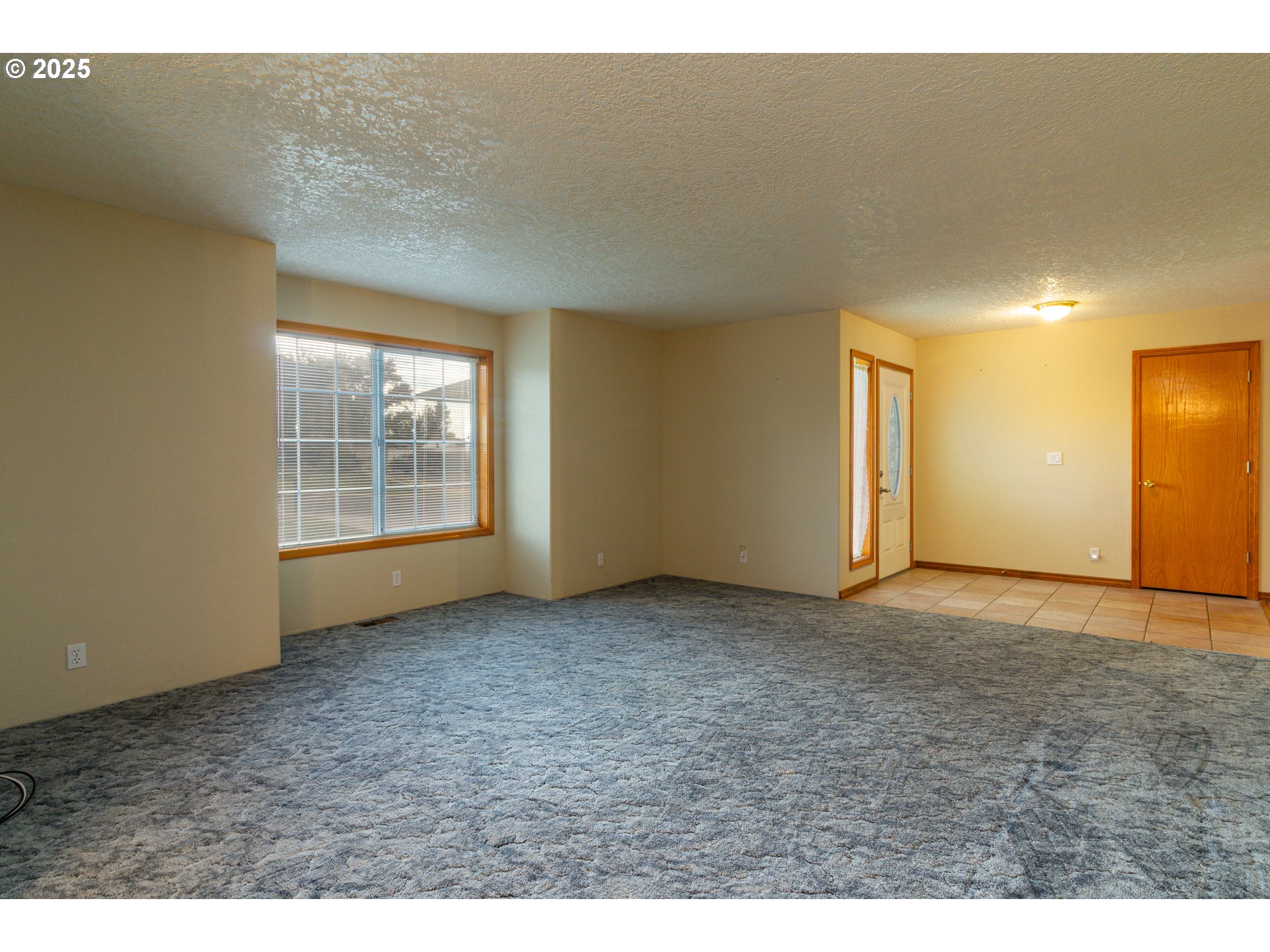 305 Northwest 9th Place Hermiston, OR 97838 - Photo 24 of 31 a view of an empty room with wooden floor and a window