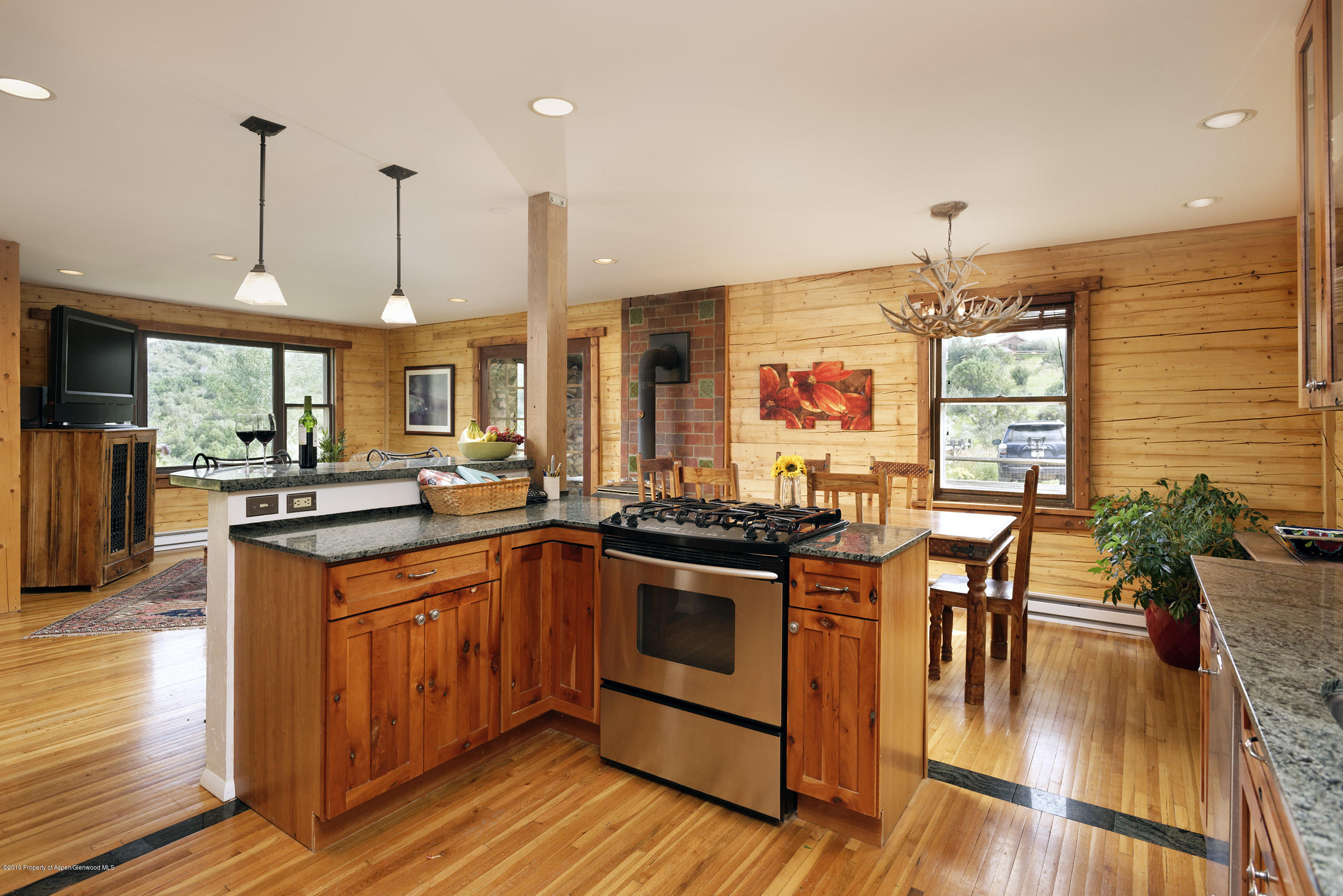 1340 Gateway Road Snowmass, CO 81654 - Photo 6 of 32 Kitchen to Living and Dining Room