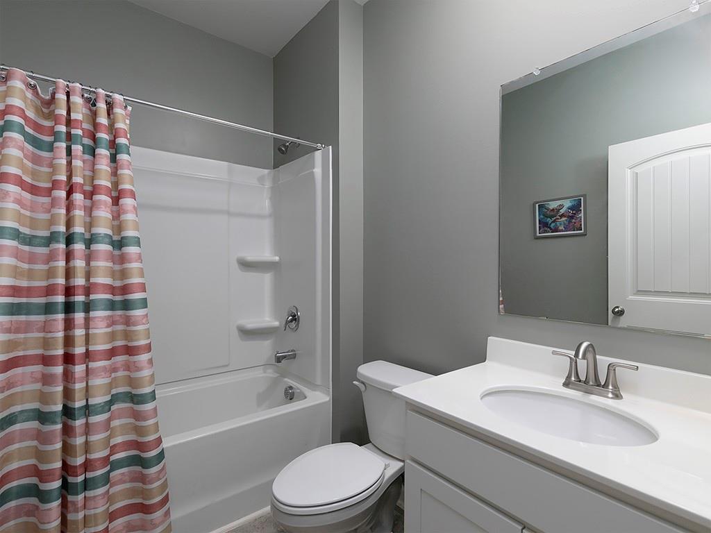 371 Highgrove Circle Dallas, GA 30157 - Photo 11 of 20 a bathroom with a sink toilet and shower