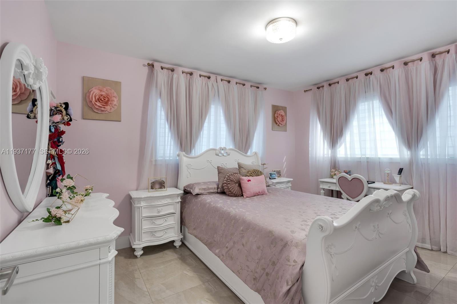 3130 Northwest 102nd Street Miami, FL 33147 - Photo 12 of 42 a bedroom with a bed and a window