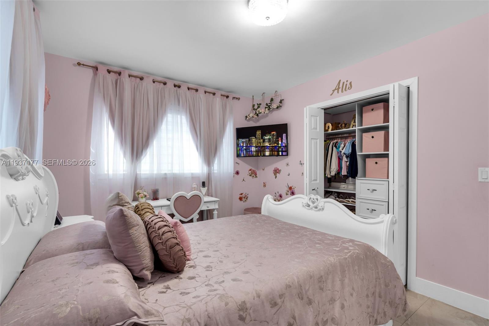 3130 Northwest 102nd Street Miami, FL 33147 - Photo 13 of 42 a bedroom with a bed and a window