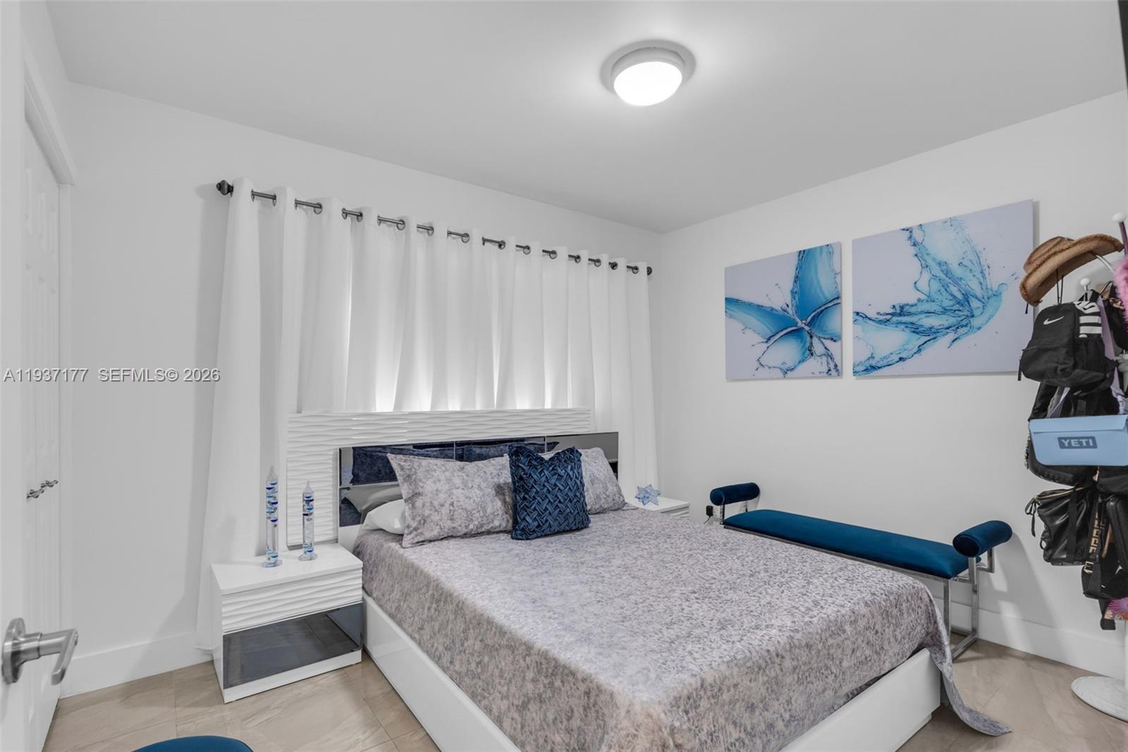 3130 Northwest 102nd Street Miami, FL 33147 - Photo 14 of 42 a bedroom with a bed and a chair