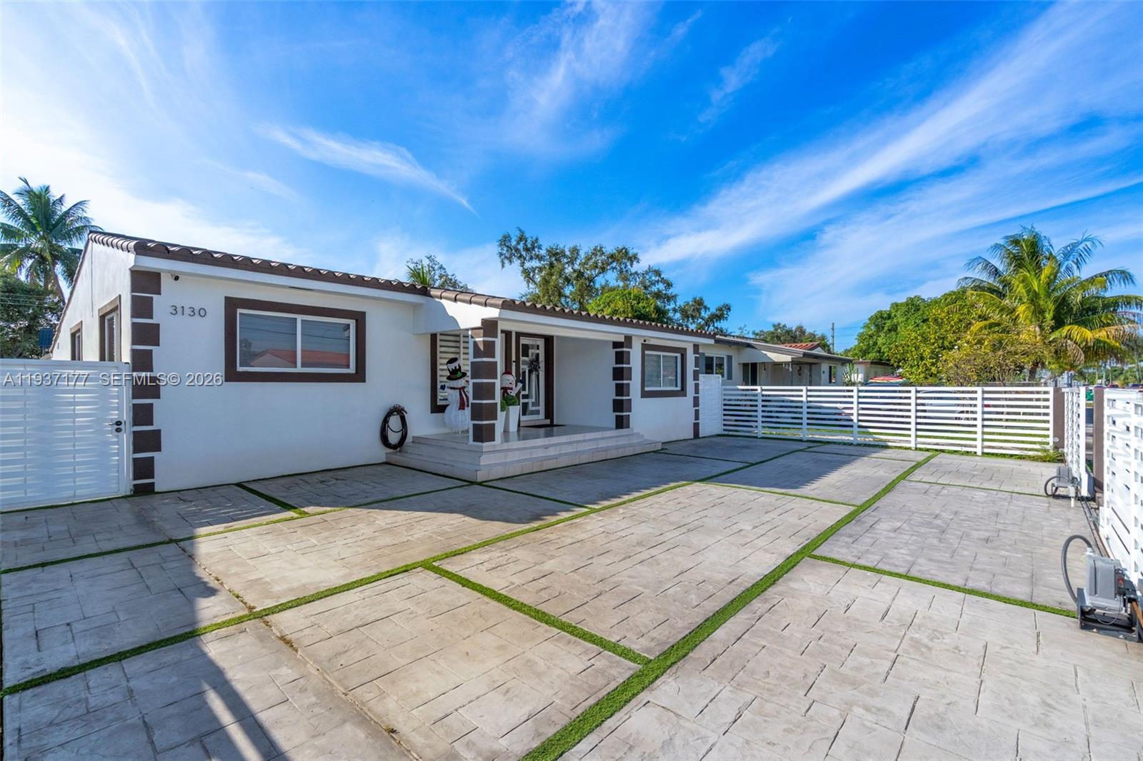 3130 Northwest 102nd Street Miami, FL 33147 - Photo 2 of 42 front view of a house with a patio