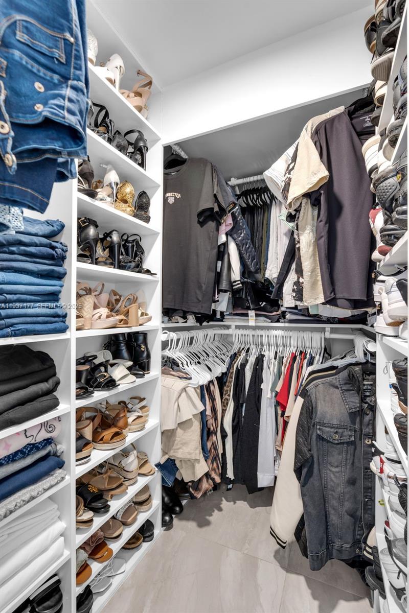 3130 Northwest 102nd Street Miami, FL 33147 - Photo 21 of 42 a view of walk in closet with clothes and shoes