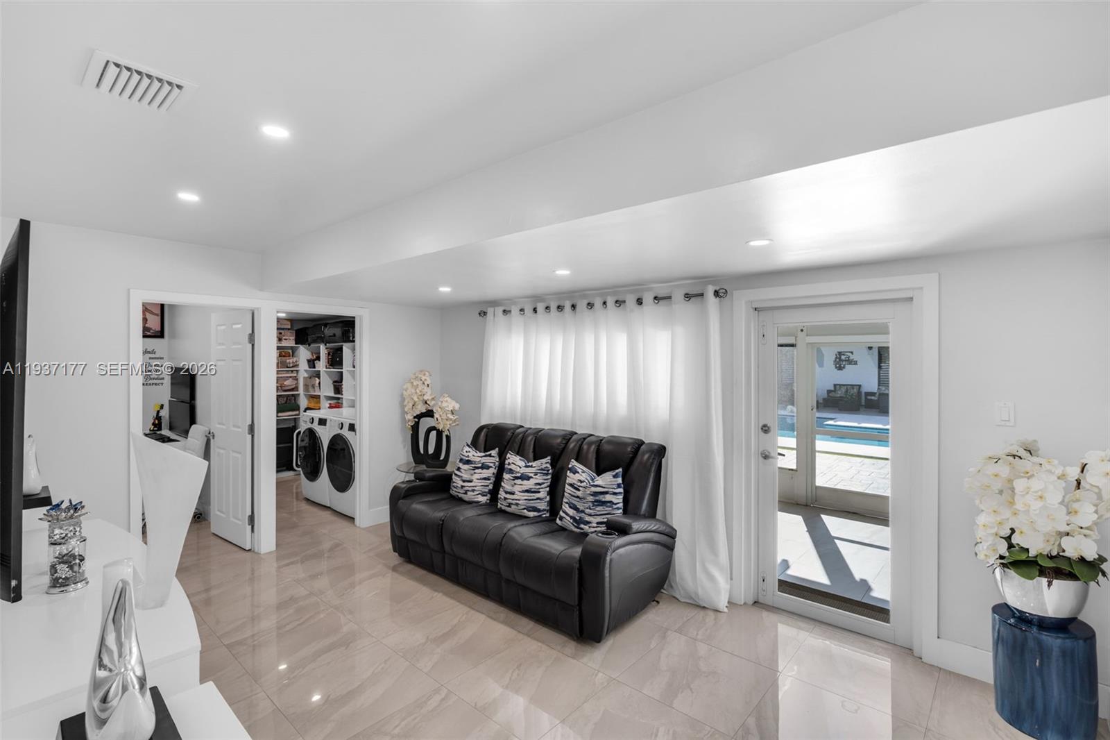 3130 Northwest 102nd Street Miami, FL 33147 - Photo 23 of 42 a living room with furniture and wooden floor